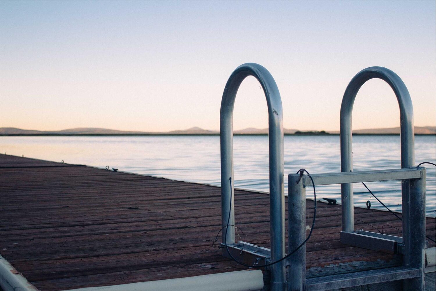 Metal ladder on a pier at the water’s edge